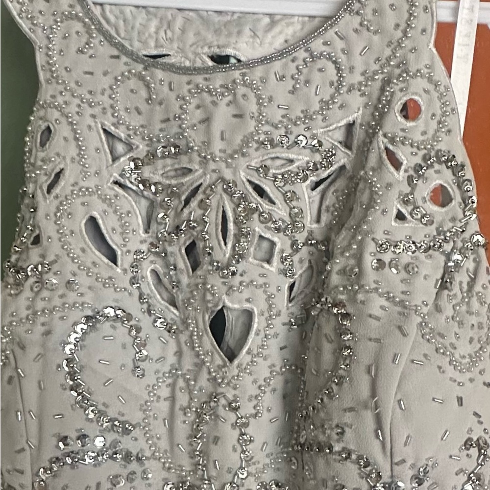 Light silver-gray occasion dress. Worn once. Has sequins and beads.